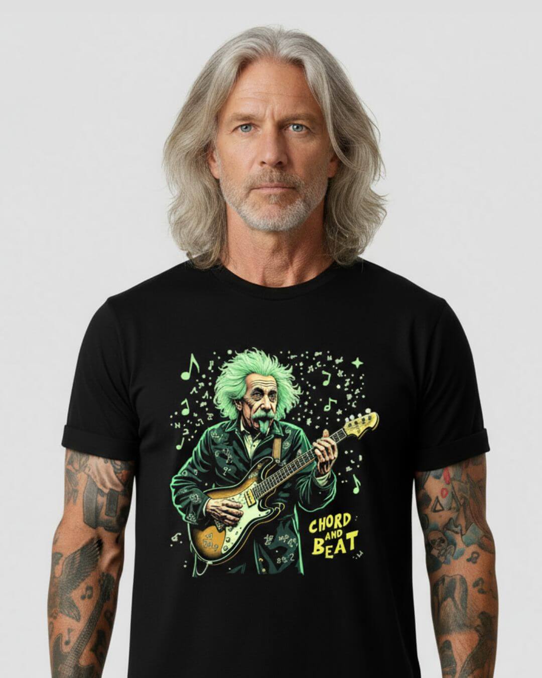 Man wearing a black t-shirt with a colorful graphic of a man playing guitar and text 'Chord and Beat'.