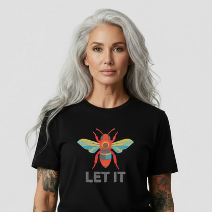 Woman wearing a black t-shirt with a colorful bee design and 'LET IT' text on a white background